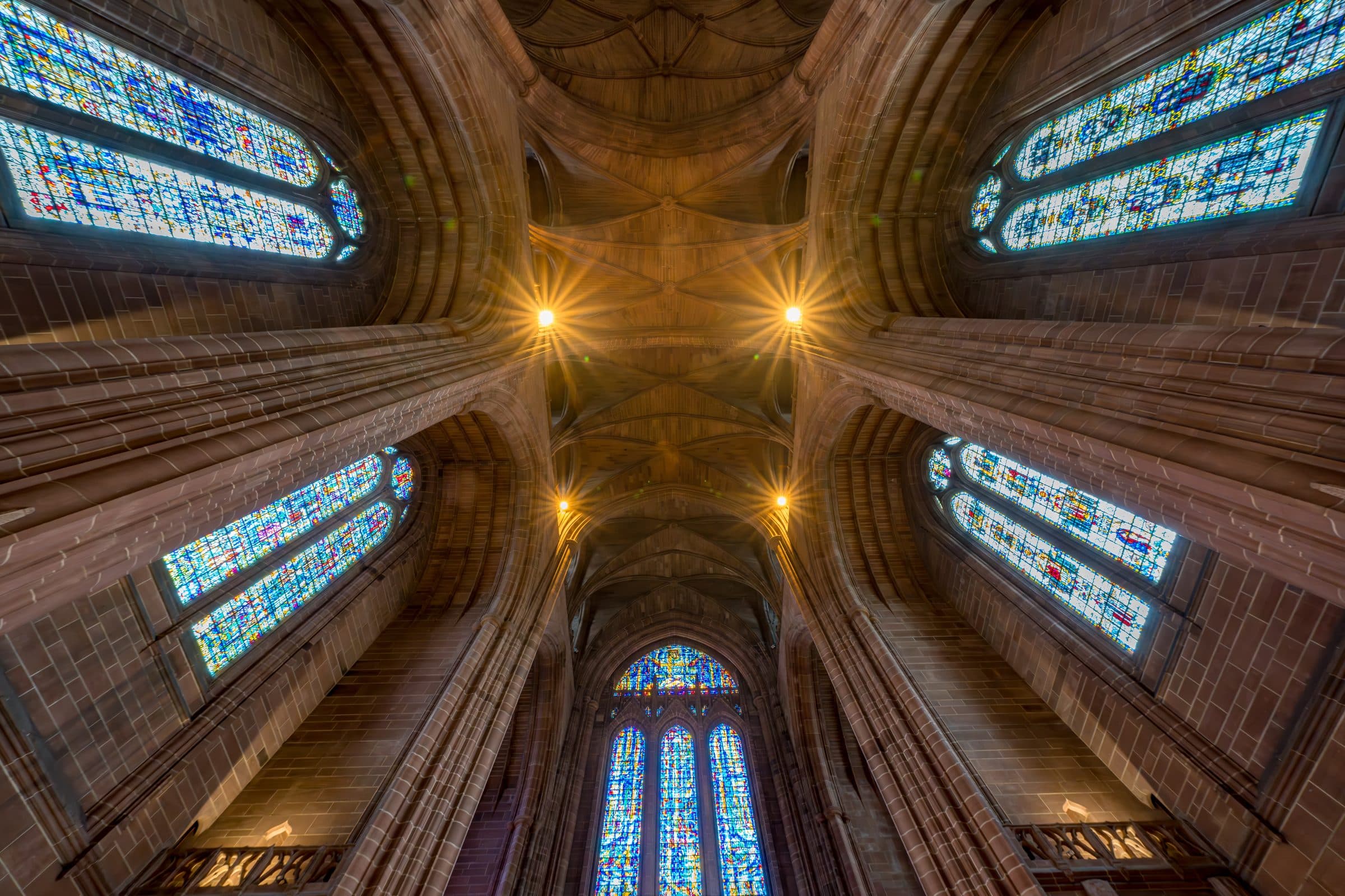 Looking directly up into the vault, with stained glass on all sides
